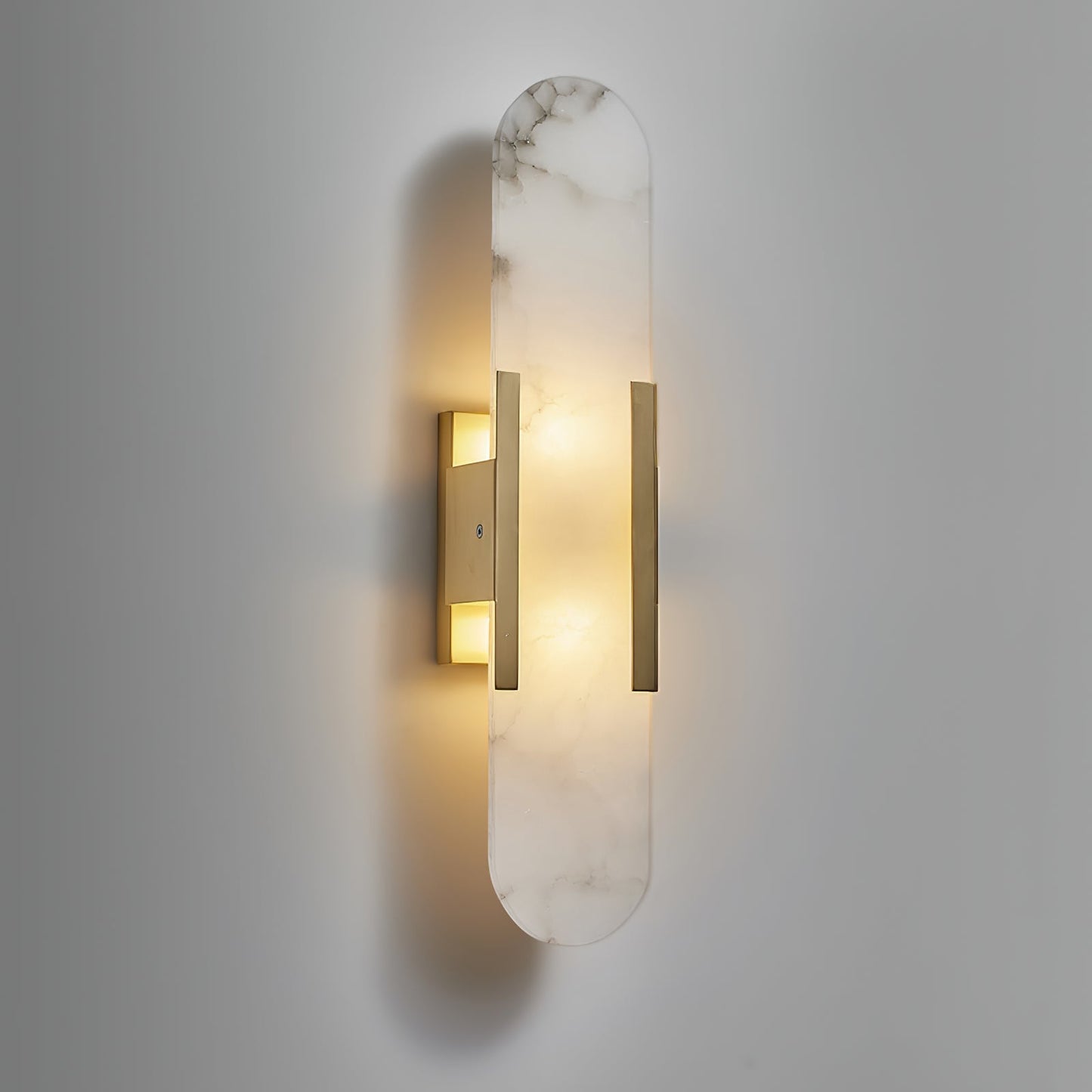 Oval vägglampa i marmor