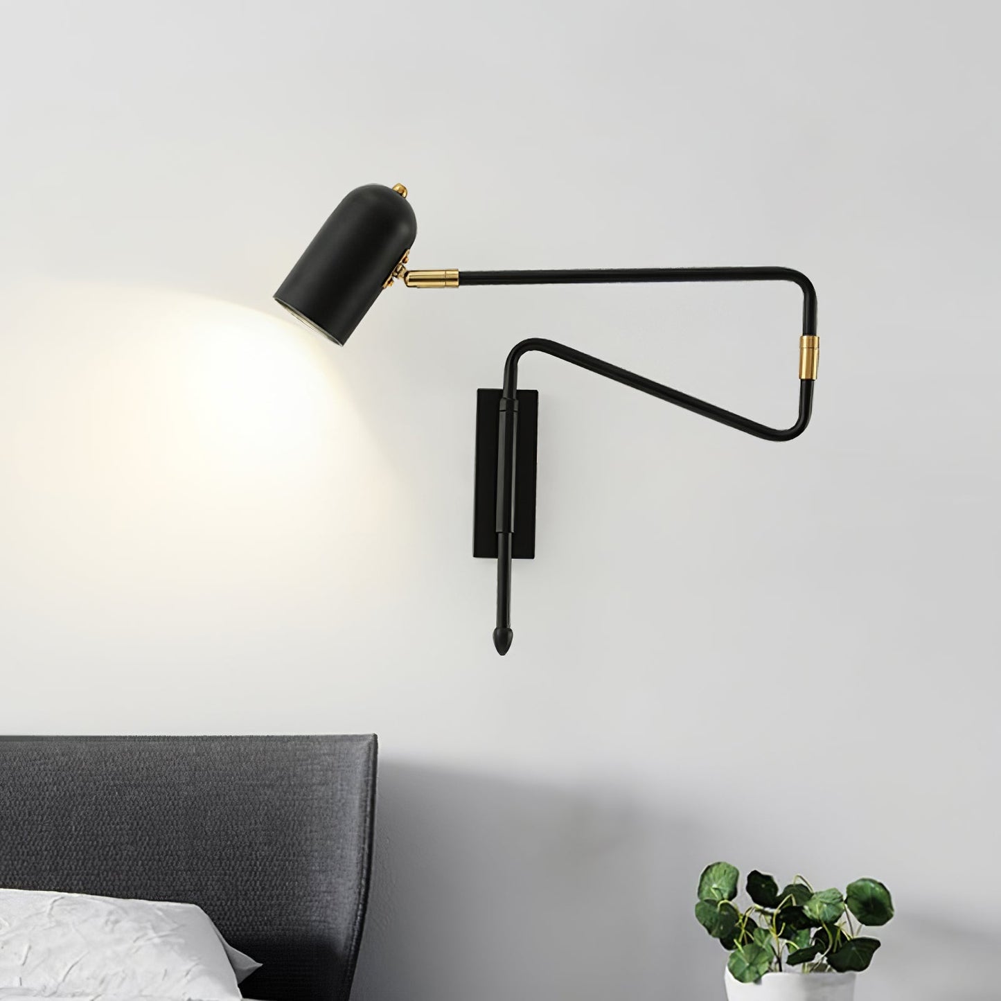 Vägglampa med roterande arm